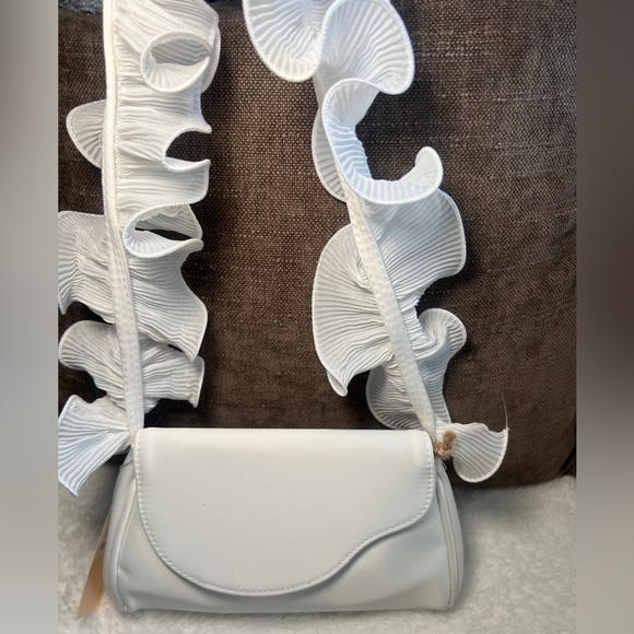 Badgley Mischka Handbags - Jewel Badgley Mischka
Woman's Sophia Ruffle Me Pouch Clutch